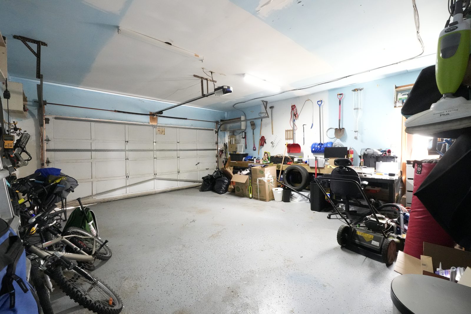 Packed garage before virtual decluttering