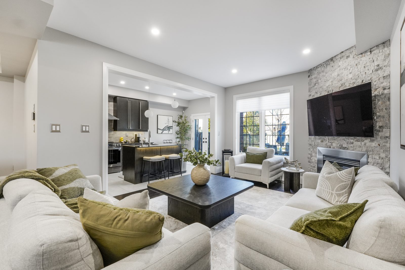 Staged living room with stone fireplace